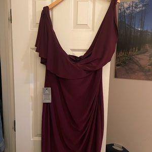 Beautiful wine coloured, wrap style dress. New with tags on from Le Chateau.